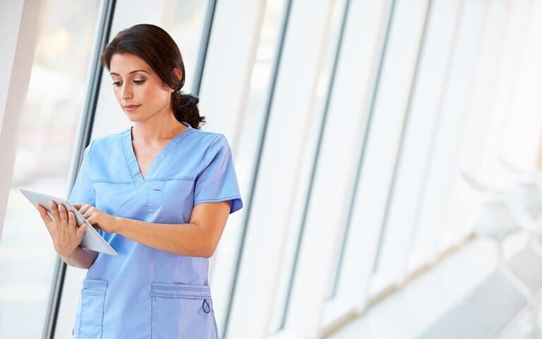 A nurse reviewing a chart