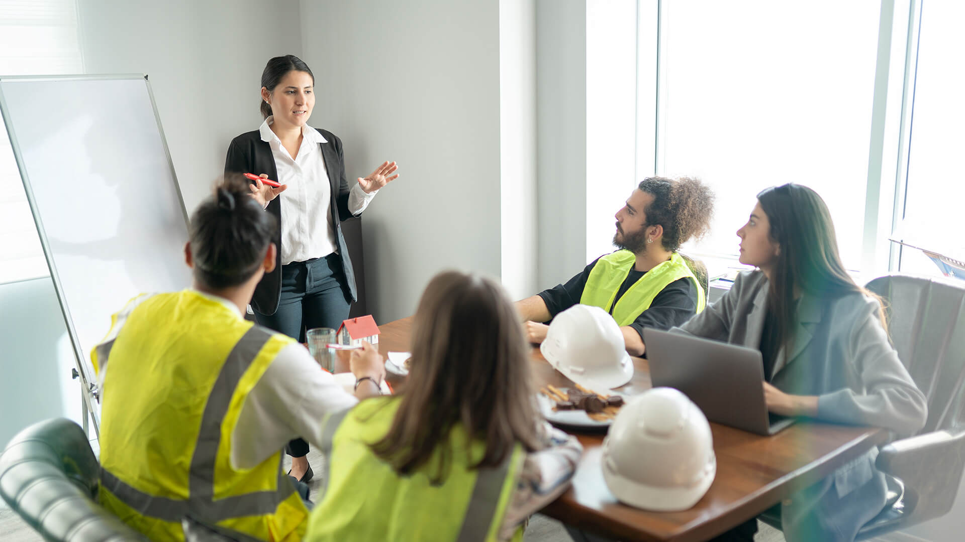 A team of individuals discussing why building a culture of safety is important.