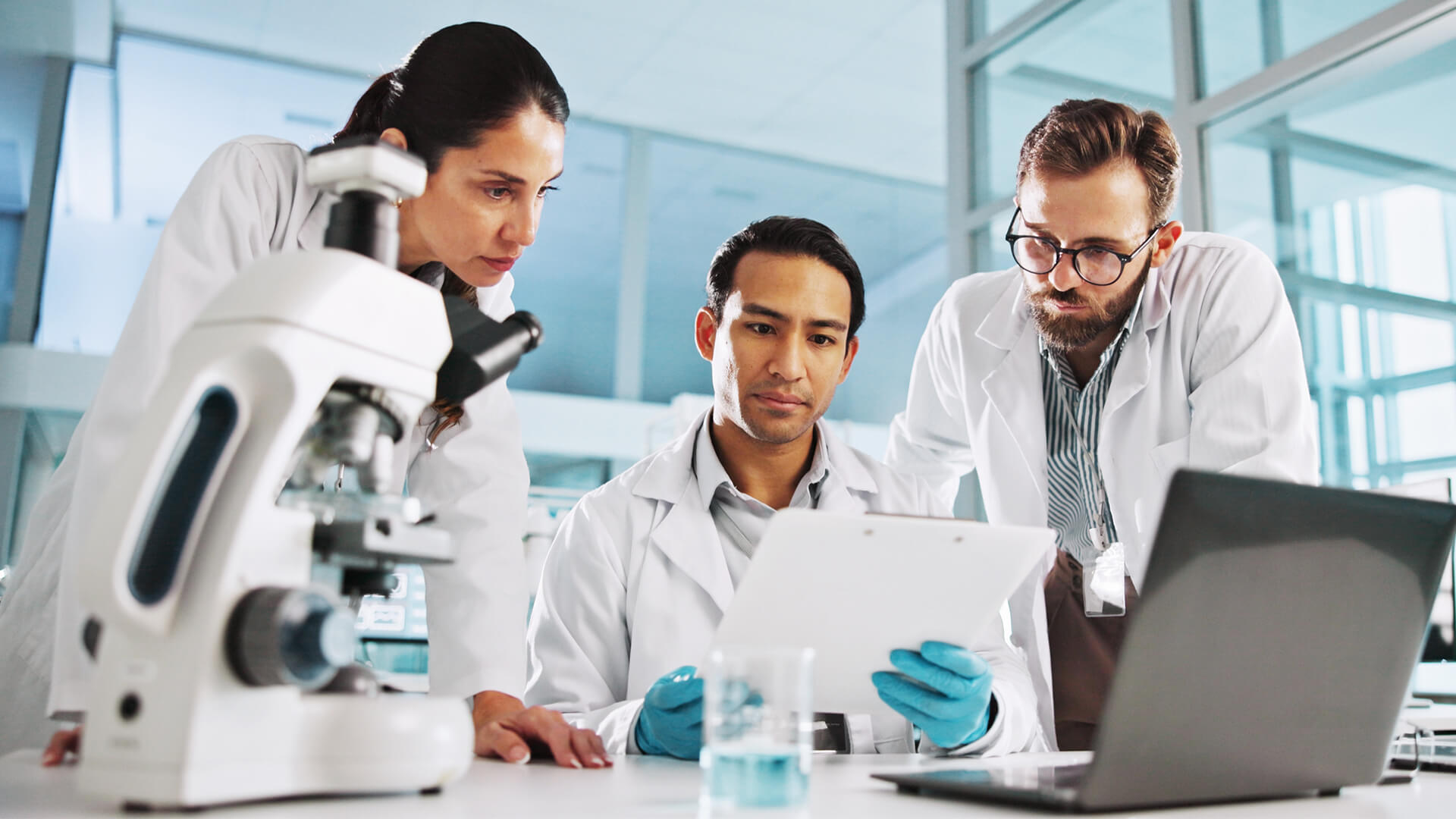 Clinical research associates and bioinformatics scientists working during a clinical trial.