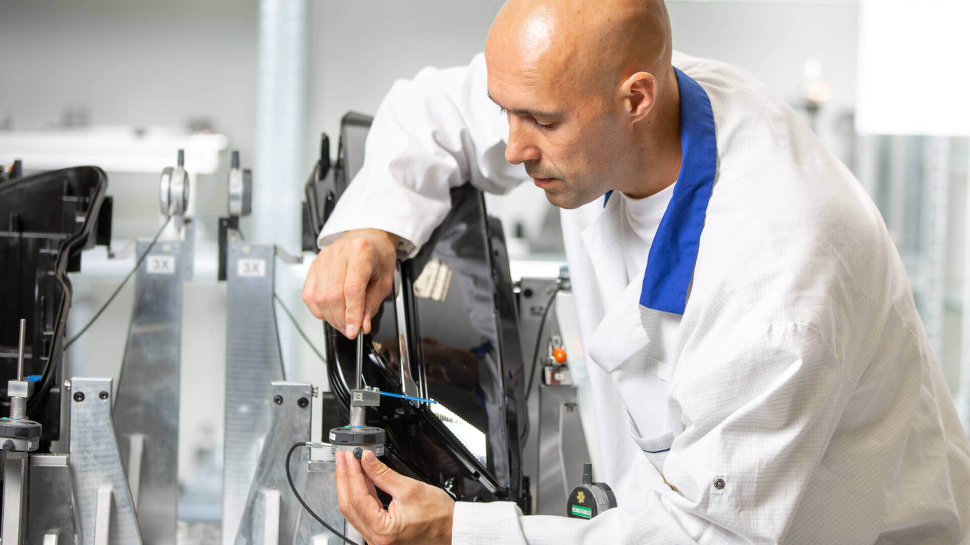 Male working on equipment in a metrology lab.