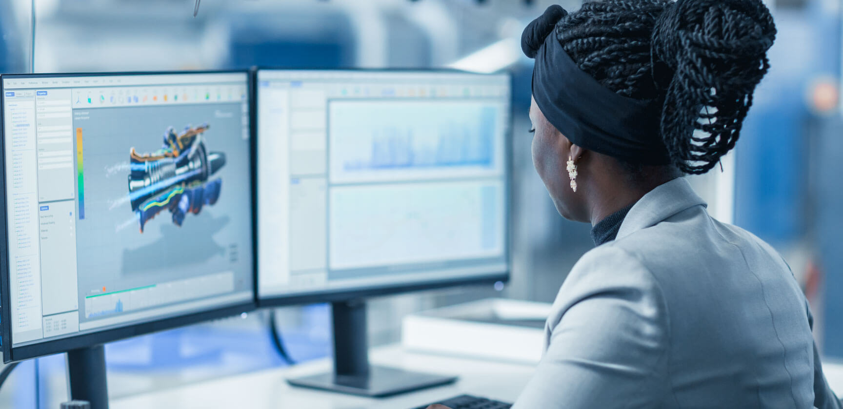 Female engineer reviews product model on computer screen