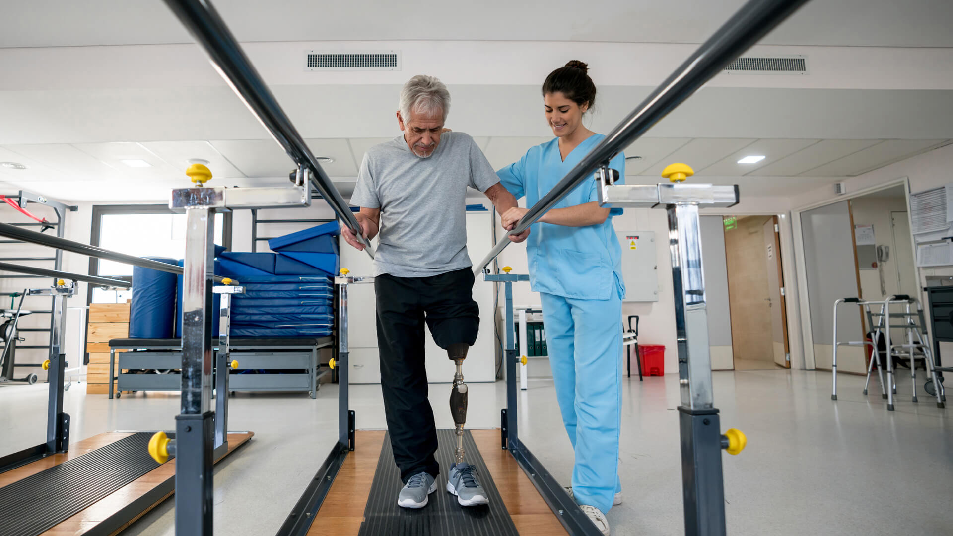 Physical therapist working with a client to conduct an IDE clinical study to submit to the FDA.