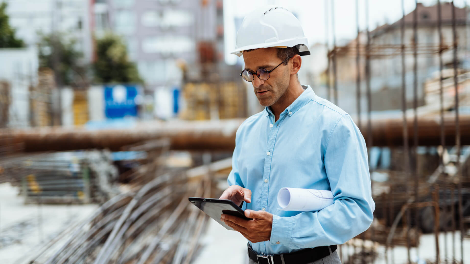 Male project manager on the construction site ensuring deadlines are met.