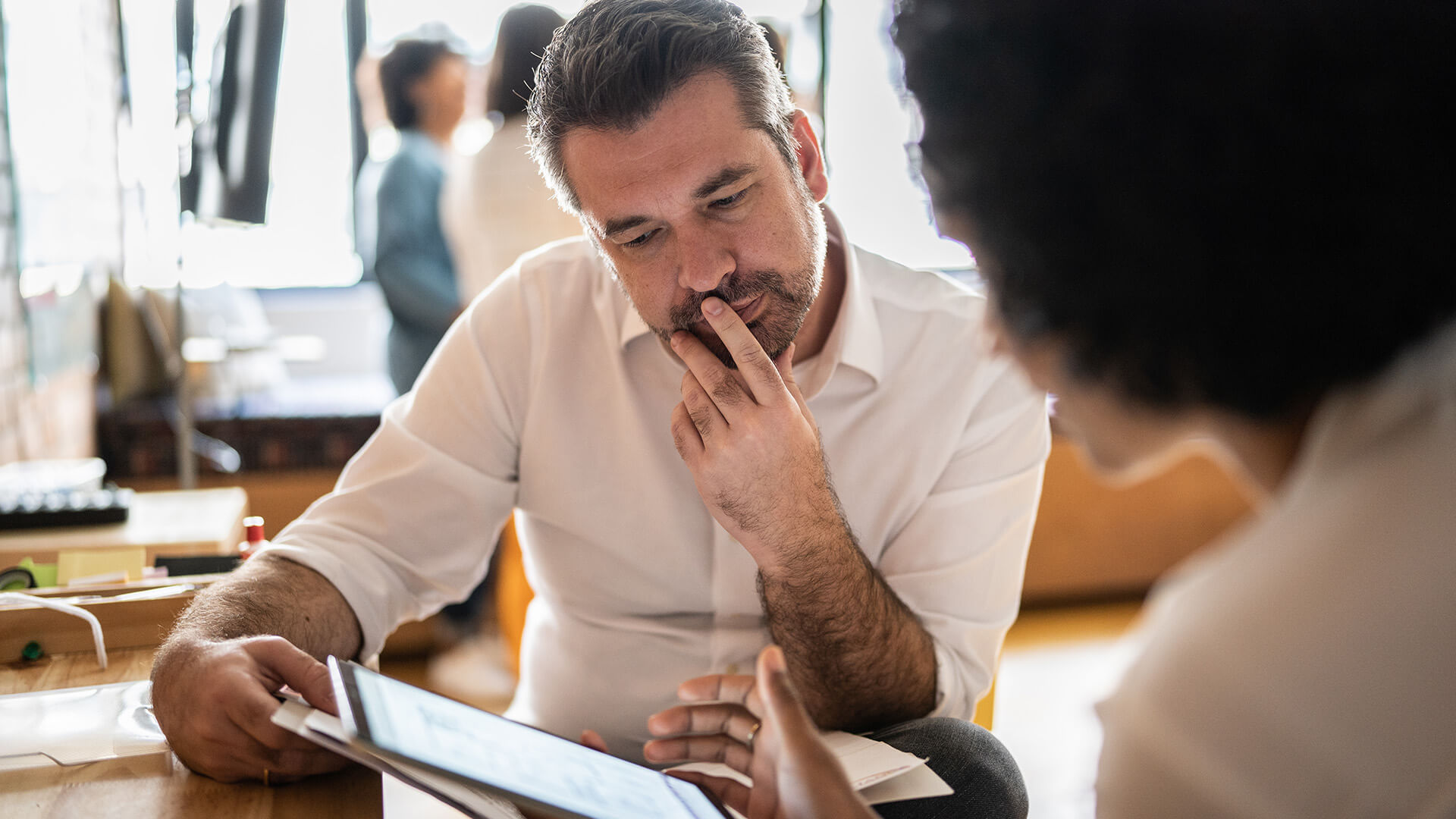 Male reviewing the May 2025 jobs report looking at labor market trends in April 2025.