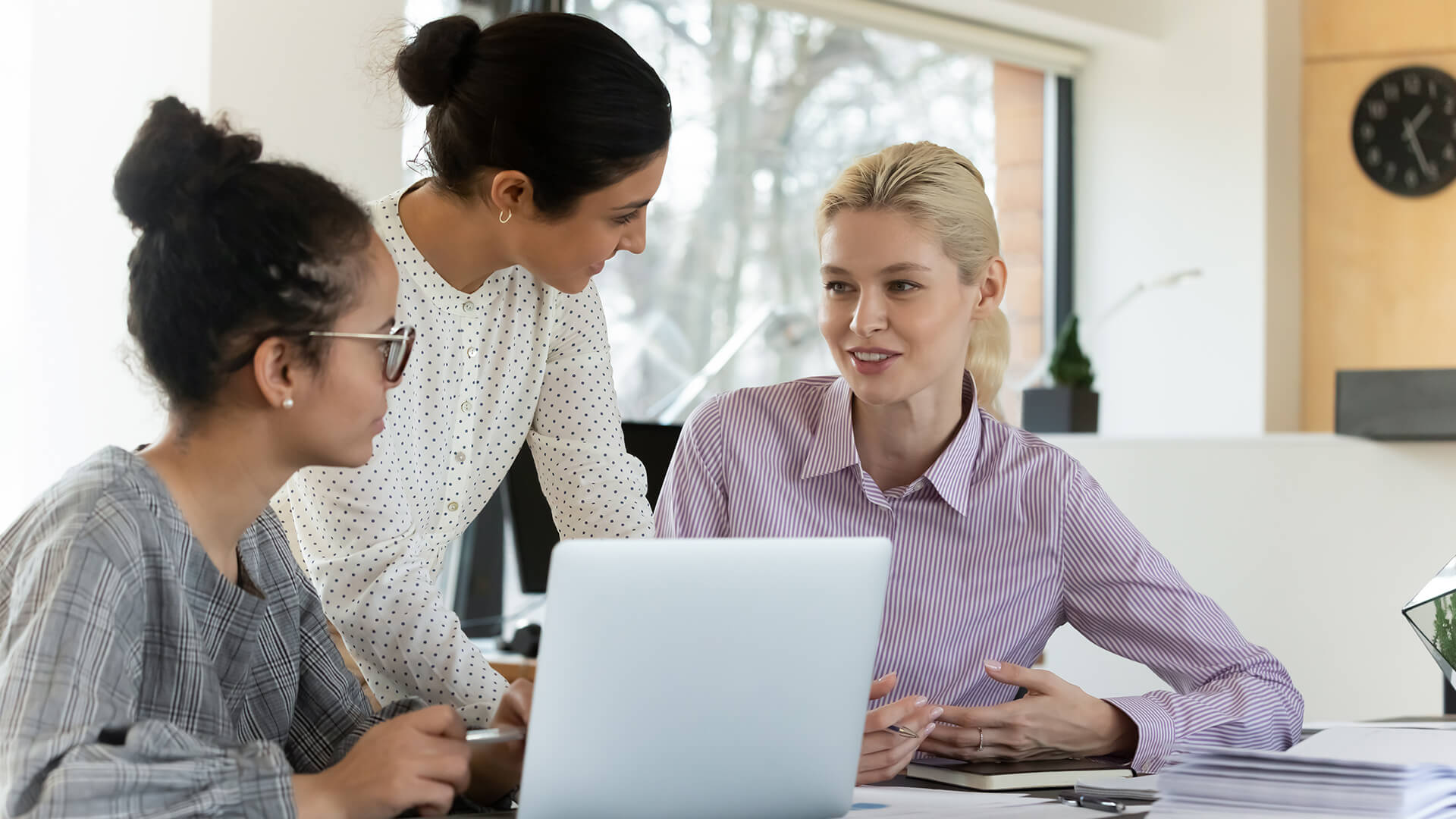 Group of female professionals reviewing the April 2026 jobs report looking at March 2026 labor market and economy trends.