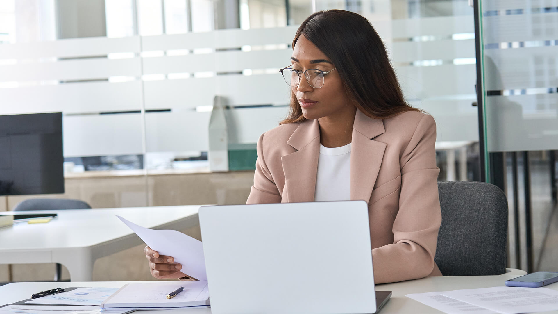 Female professional reviewing what has been released for the 2025 October jobs report. U.S. Bureau of Labor Statistics (BLS) has paused updates to its website and data releases until government operations resume. Once released the labor market and economy report will look at trends in September 2025.